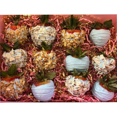 Chocolate covered strawberry with almond walnuts and plain blue chocolate, drizzle