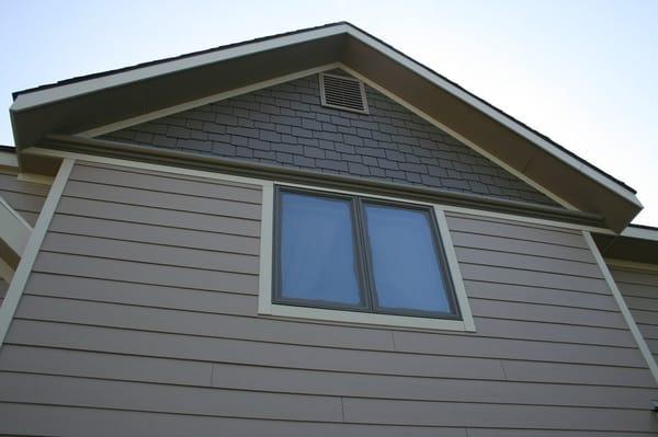 James Hardie lap siding in Khaki brown, shingles & crown  in Timberbark, trim in sandstone beige