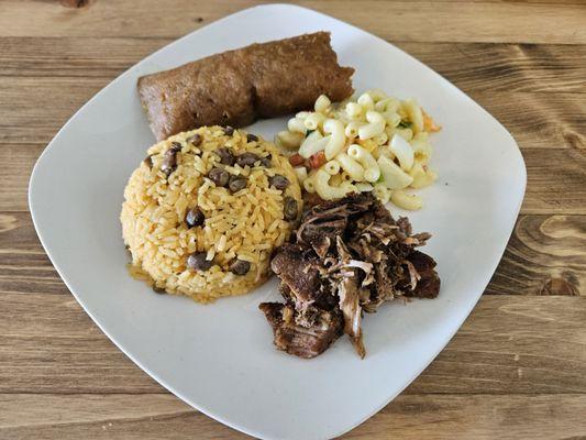 Pastel, pernil, arroz con gandules, and coditos.