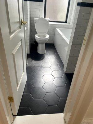 Refinished bathroom, previous was old pink tile and a tub you had to stand in the middle of.