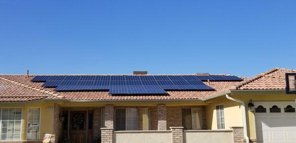 The roof on this home makes the solar look like a beautiful wave. I love the contrast of colors on the roof