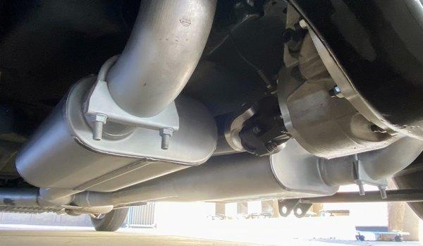 A fresh set of Walker Ultra Flow welded mufflers cleanly installed.