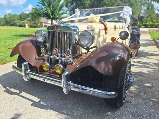 With its classic design and vintage charm, this 1952 MG TD Roadster will add a touch of nostalgia to any wedding celebration.