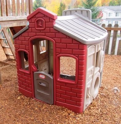 One of two play houses on the preschool playground