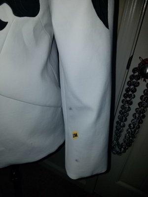 Brand new never been worn White House Black Marker blazer damaged by Dacula Cleaners.