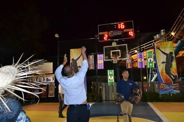 Participating in a basketball shootout at Six Flags