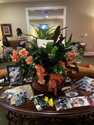 Arrangement received with fake peach flowers.