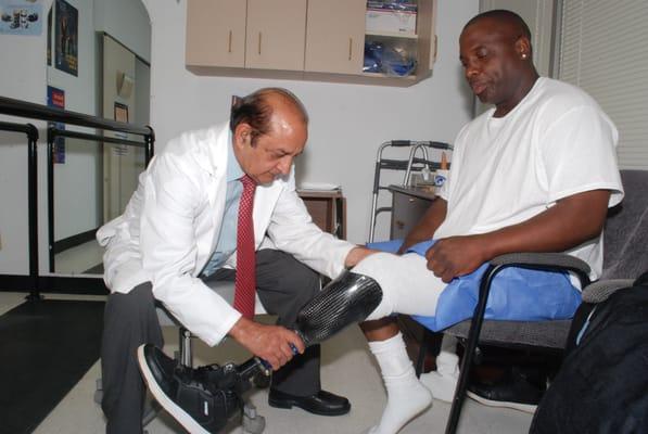 Dr. Hanif Chaudry fitting a Veteran with a Leg Prosthesis