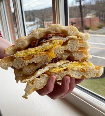 Bacon egg and cheese on a Belgian waffle