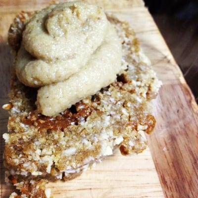 raw vegan cinnamon roll with maple frosting