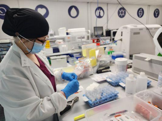 Lab worker analyzing blood samples