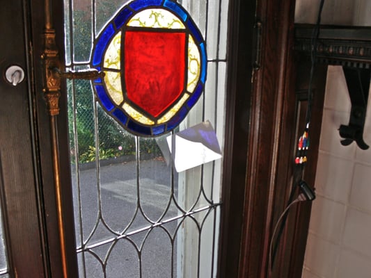 Photo 1: Mishapened, loose french door glass panels