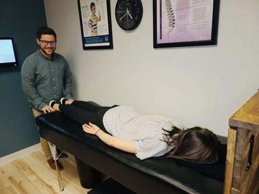 Dr. Evan Norum adjusting a patients spine.