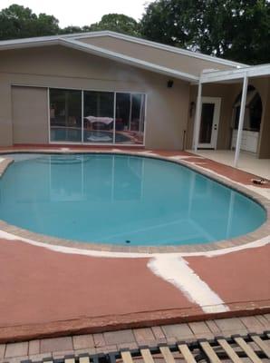 Before final painting of pool deck to include patching and edging