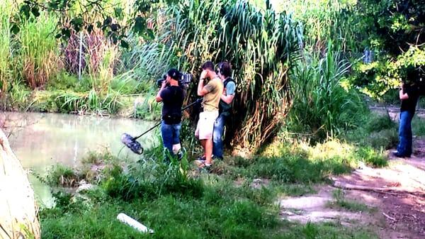 Medical staff and safety divers on location with film production crew.