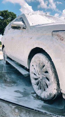 Amazing action shot of a foaming pre wash on a customers Lincoln Navigator.