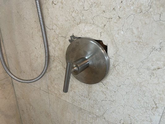 The problem - new shower doesn't cover old hole