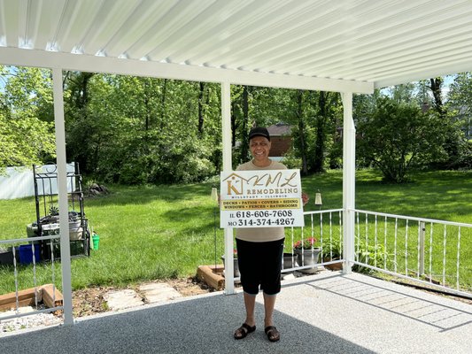 KML Remodeling happy customer showing off her new Rockin patio cover!