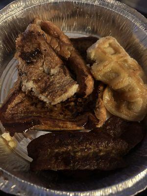 Two French toast and a waffle to show for example and sausage