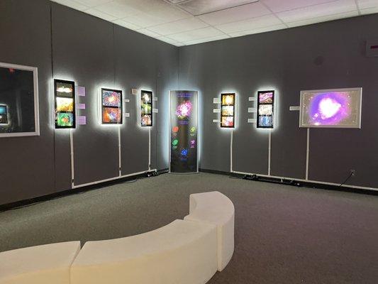 Backlit galaxy exhibit.