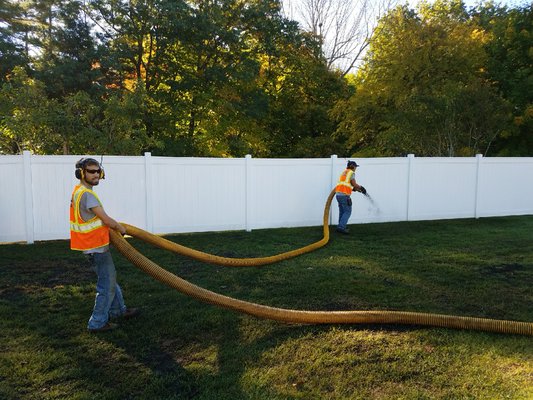 Top Dressing a lawn! This is an application of compost on the lawn to enhance soil quality and nutrient availability.