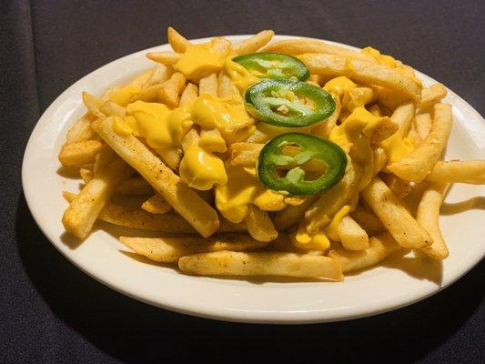 These are the fries with cheese they offer in their bar menu, these are soo good,