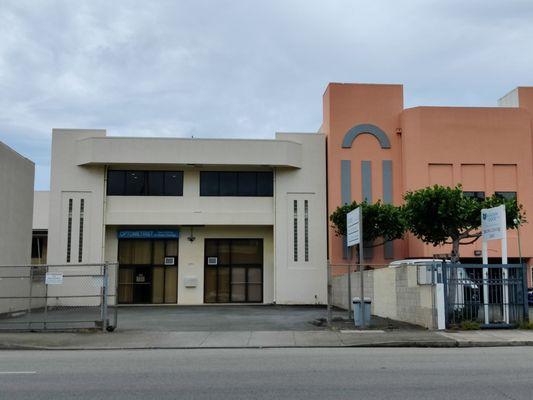 Located on the second floor of the beige building, right before the adobe colored building on the left side of Beretania Street