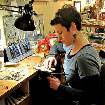 Owner Rachael Winkley working at her bench