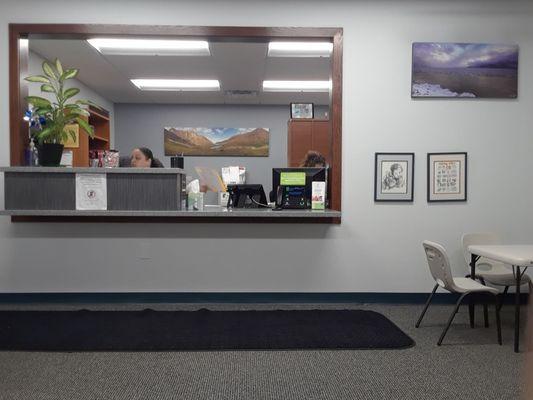 The check-in desk in the waiting area.