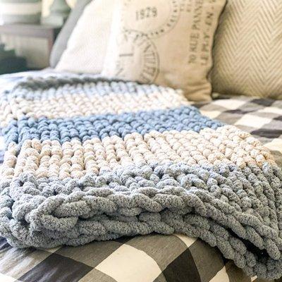 Chunky Knit Blankets are an absolute must do DIY activity!  These make amazing gifts and perfect comfort while snuggled up in your home.