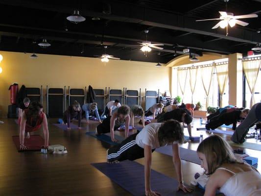 Yoga class in one of our studios at Pilates Plus.