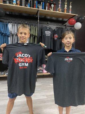 The Jaco children selling new shirts