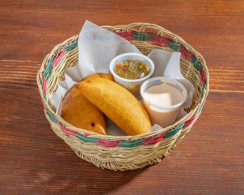 Chicken and Beef Empanadas!  Bite into white corn dough filled with juicy chicken and savory beef, seasoned for an explosion of taste!