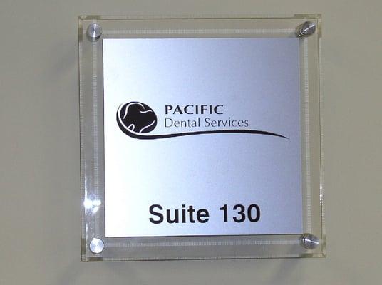 Contemporary aluminum & acrylic ADA sign with standoffs