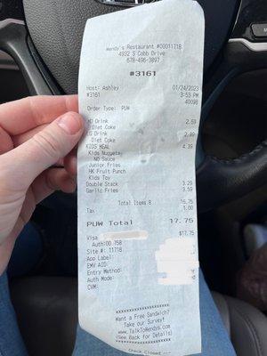 Receipt showing price of two drinks and a kid's meal.