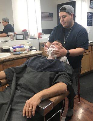 Daniel with a hot towel shave.