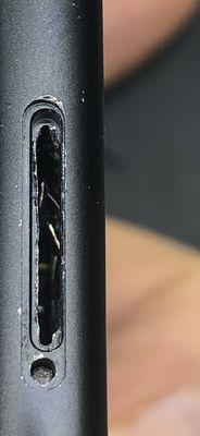 An inexperienced repair shop attempted to remove a sim card that was inserted without a tray.