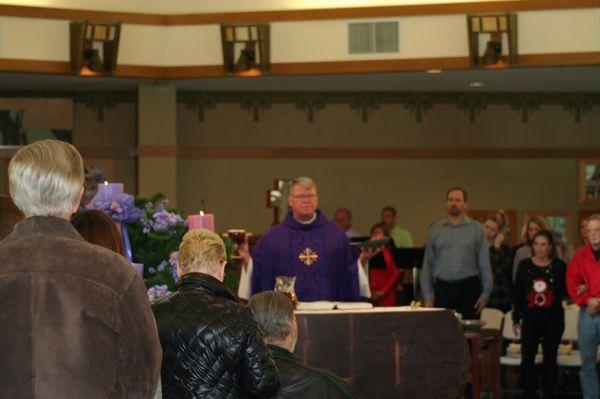 Father Tim Ramaekers celebrating Mass at Corpus Christi Catholic Church