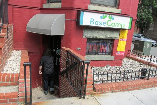 street view showing steps down into basement area where business is