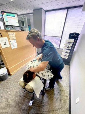 Dr. Smedstad adjusting a patients neck.