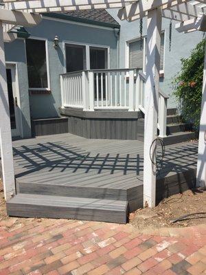 Great deck built by Carpenter Construction. Note that the trellis and posts were already there from previous deck.