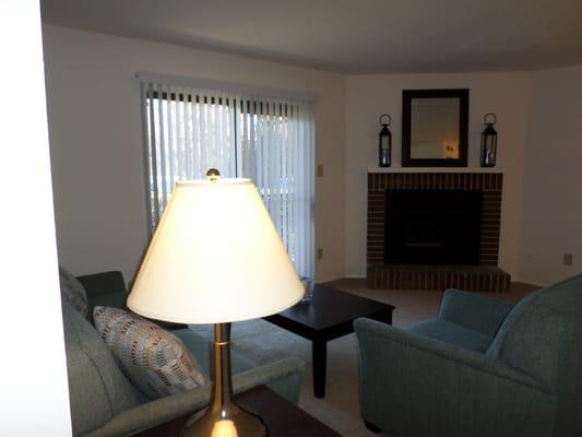 Wood burning fireplace with decorative mantel.