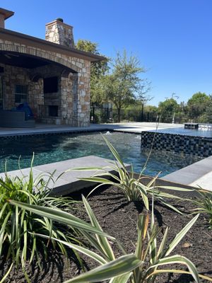 Raised steel beds to line up perfectly with the pool, metal trellis with star jasmine and DG for dog area with turf