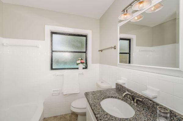 Updated hall bathroom with new vanity and mirror and paint.