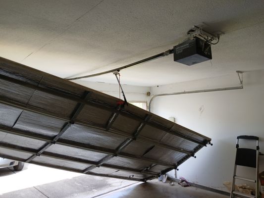 Broken overhead garage door Farmersville  Texas