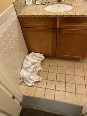 Dirty towels on floor