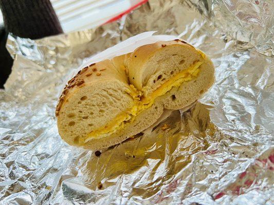 Egg and cheese on an onion bagel