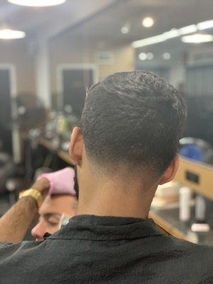 A bald fade neckline on a Cowrker