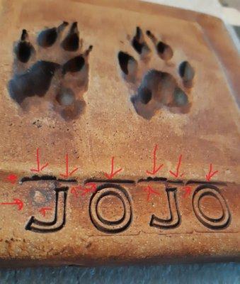 The red arrows are the staining mistakes. These are just sloppy work. The white spot next to my cat's name is distracting