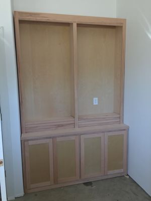 Custom bookshelves. Shelves are adjustable and sitting on top of the counter.